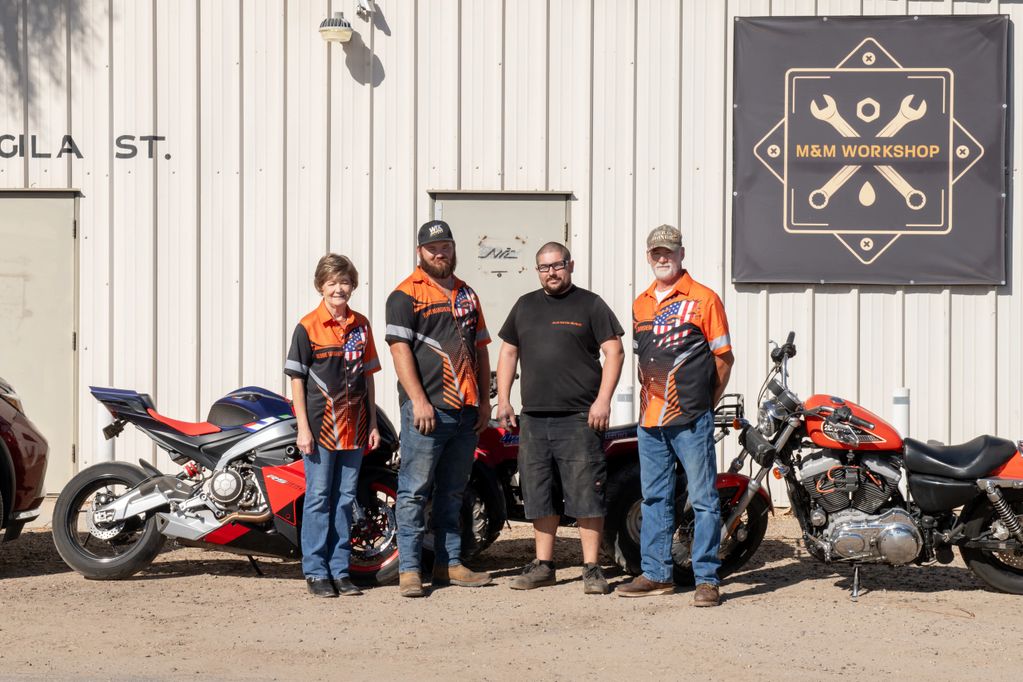 M&M Workshop team in front of the shop